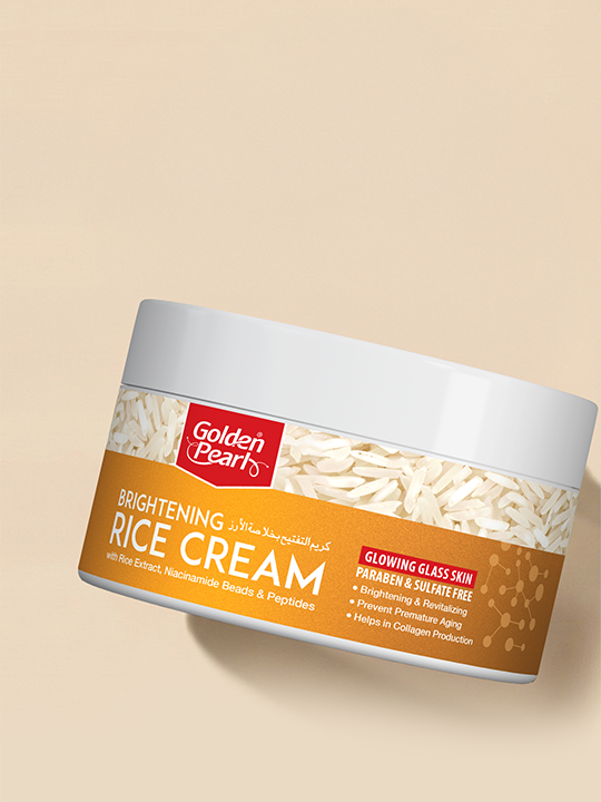 Jar of Golden Pearl Brightening Rice Cream on a beige background