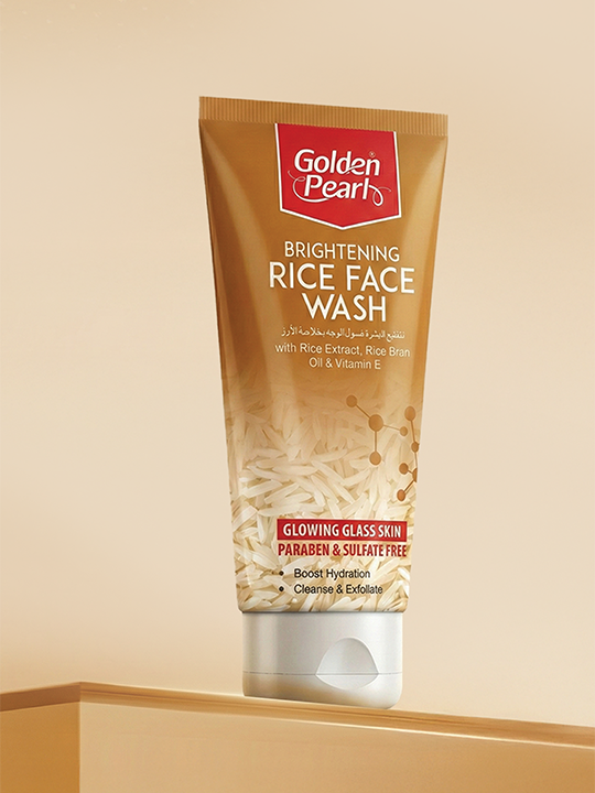 Tube of Golden Pearl Brightening Rice Face Wash on a beige background